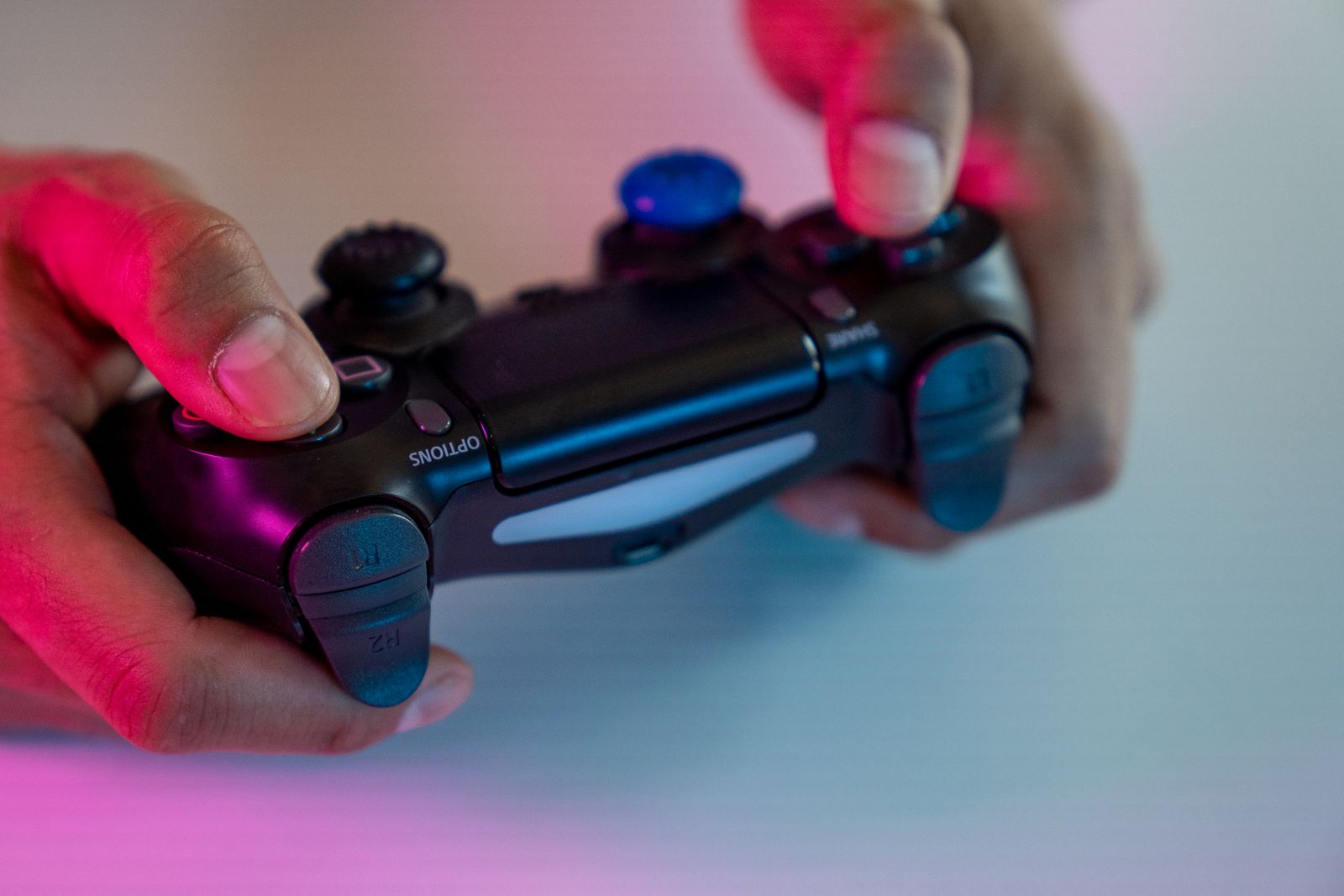 Hands gripping a game controller
